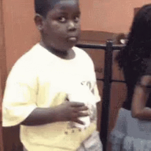 Black Kid Holding Cup Meme, Explained