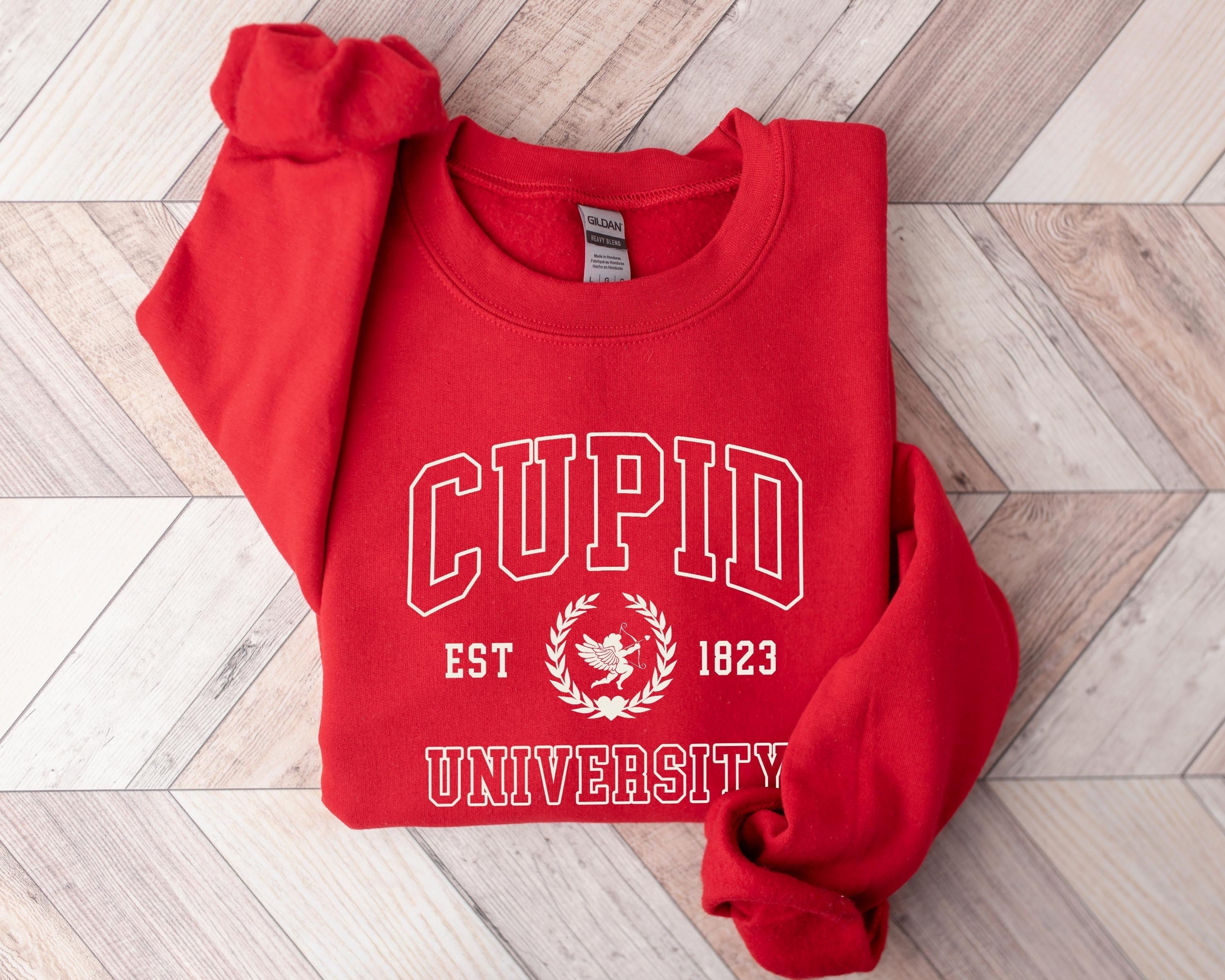 Funny College Sweatshirt: Get Cozy and Cute with our Cupid Sweater