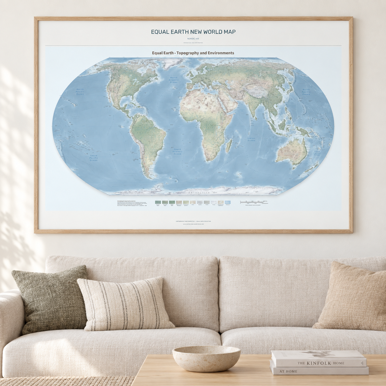 Equal Earth New World Map — Nordic Air, framed A0 landscape print shown in an interior. AI lifestyle visualization; frame and furnishings are not included.